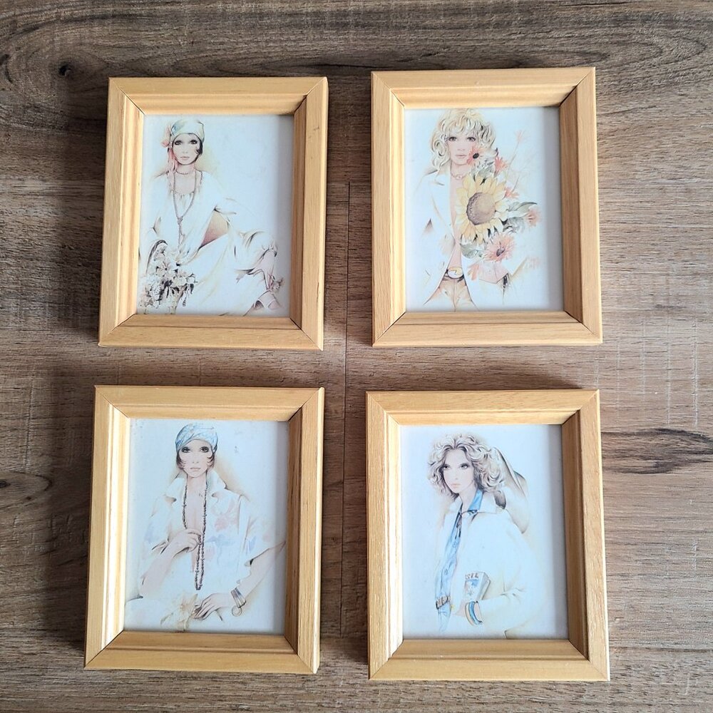 Set of 4 small framed pictures. Portraits of women.